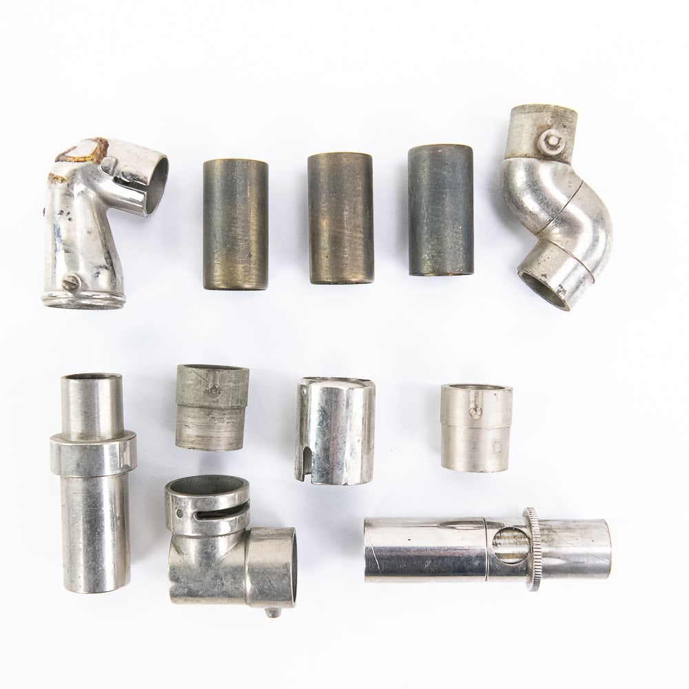 11-Piece Lot of Various Cylinder Phonograph Elbows: Mostly nickel-plated elbows of unknown origin, in as-found condition and being sold for parts or restoration. See photos. From the Allen Koenigsberg Collection