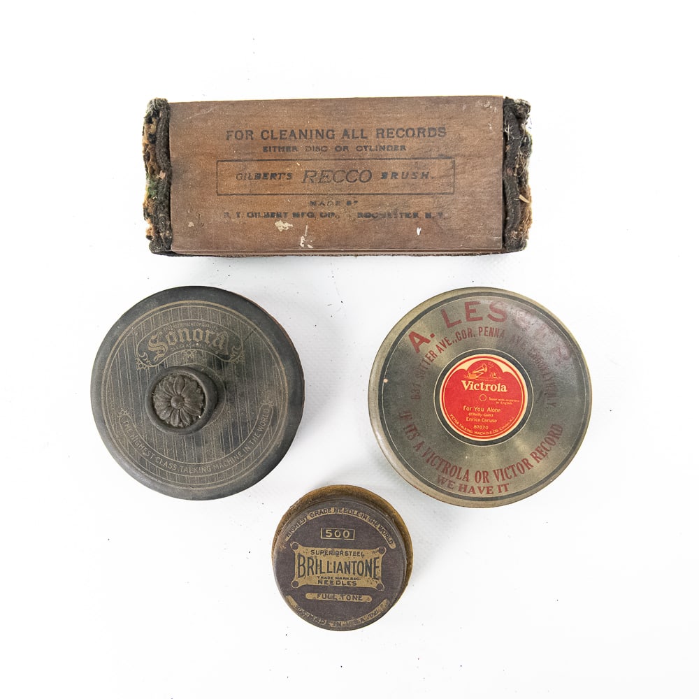4 Piece Lot of Record Dusters: Four interesting record dusters featuring advertising. Three are round (one of which has storage for phonograph needles) and one is a large carpet-covered duster. See photos for details. From the