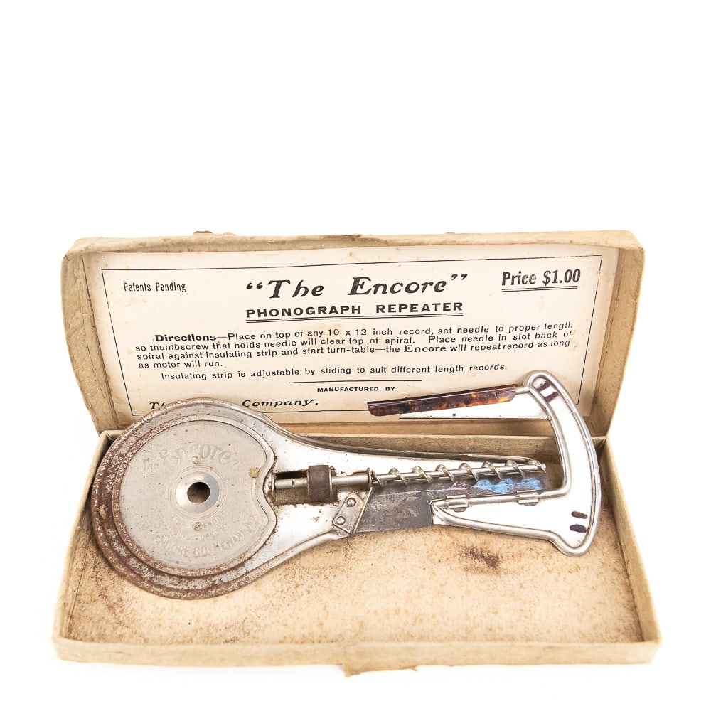 The Encore Phonograph Repeater in Original Box: Unused old stock Encore phonograph repeater for a disc phonograph. Repeater has its original two-piece box which has advertising on the top cover as well as instructions on the inside. The repeating