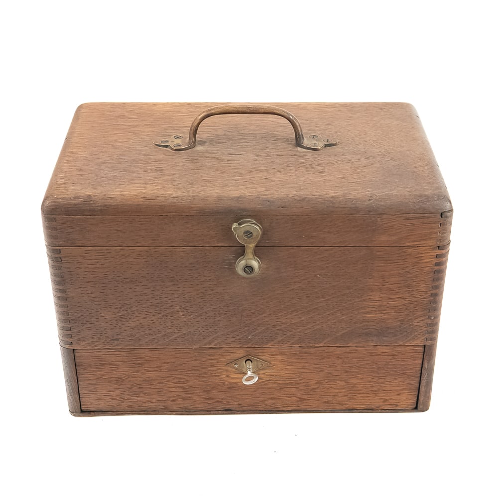 Oak Cylinder Record Carrying Case: Nice small size oak carrying/storage case for cylinder phonograph records. Hinged top opens to 6 wood record pegs with a locking supply drawer (key included) below. Has cast brass carrying handle and
