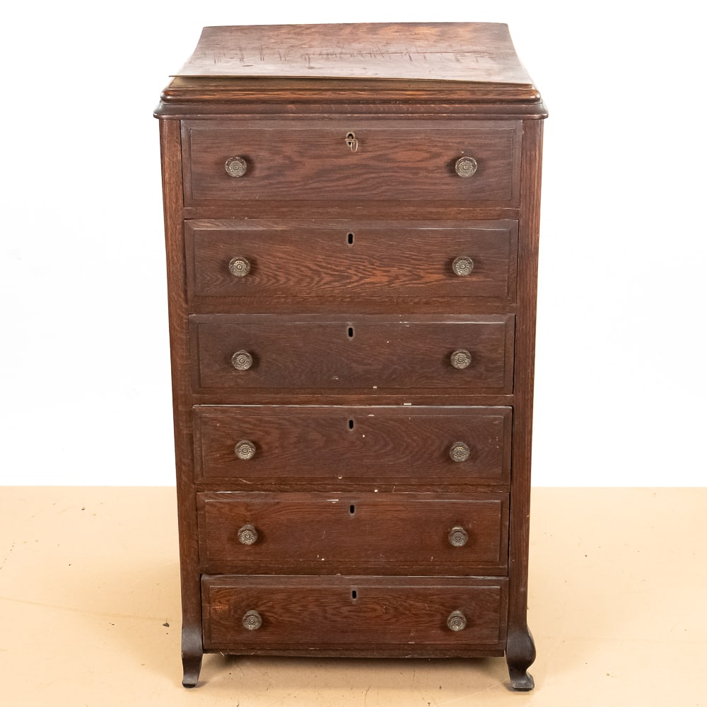 6 Drawer Oak Cylinder Record Cabinet: Quartersawn oak Edison phonograph cylinder record cabinet, dating to the late 1900s or early 1910s. Features six drawers with ornate, decorative brass pulls and integrated escutcheons. The top drawer 