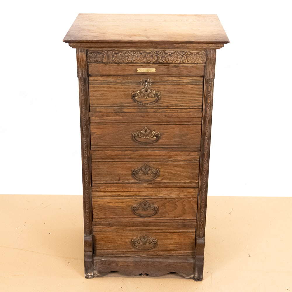 5 Drawer Douglas Phonograph Co Cylinder Cabinet: This exceptional turn-of-the-century quarter-sawn oak cylinder record cabinet is an incredible piece of early recorded sound history, proudly retaining its original celluloid label for the "Douglas