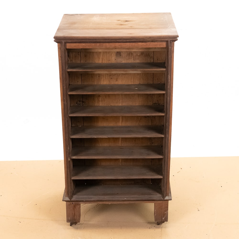 Oak Cylinder Record Cabinet: This exceptional turn-of-the-century Mission-style oak cabinet features a highly specialized open shelving configuration engineered for early audio enthusiasts, utilizing a central vertical divider