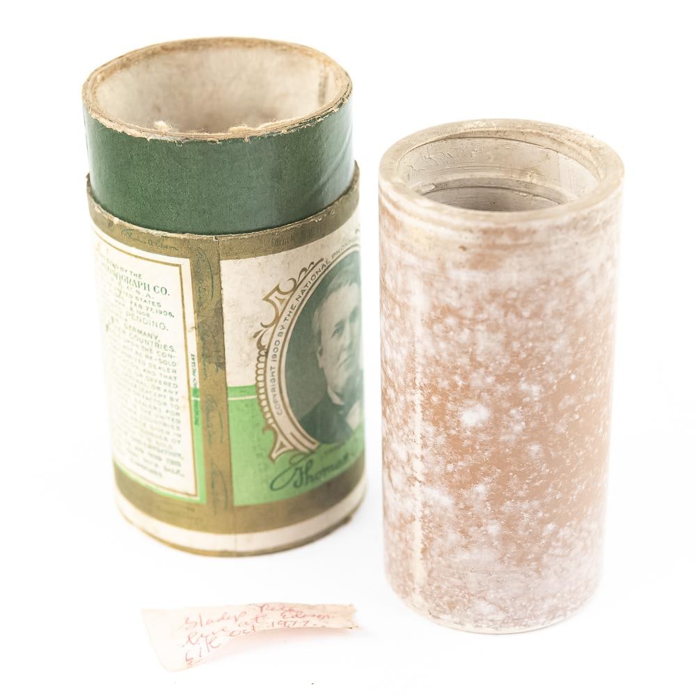 Brown Wax Cylinder Record: Brown wax cylinder record. Stable condition. Heavily spotted, mold, oxidation. In an original Edison storage tube. H 4.5", W 2.5", D 2.5". Please see photos for condition. From the Allen Koenigsberg c