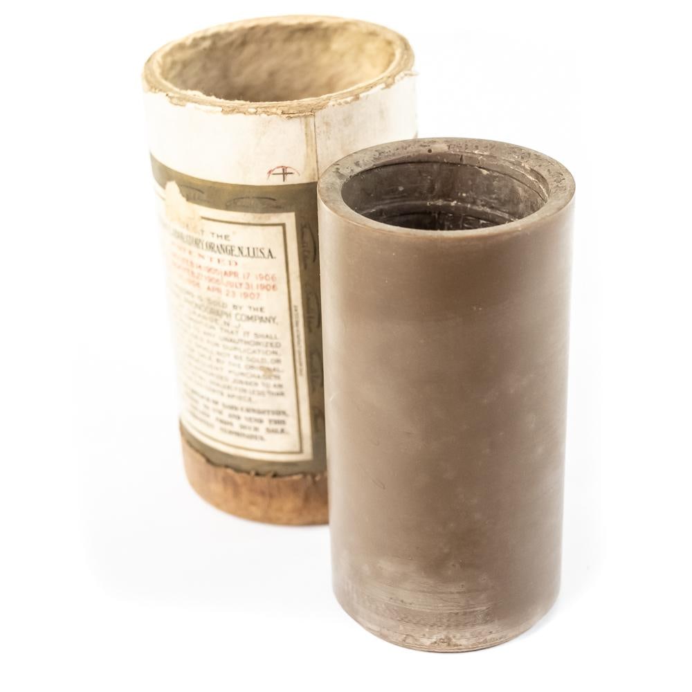 Brown Wax Cylinder Record Piano Solo: Brown wax cylinder record includes a hand-written slip identifying the recording as a "Piano Solo by Mr. Paul Paulheimer, Pittsburgh 'A Cakewalk'". The wax cylinder itself looks to be in good stable c