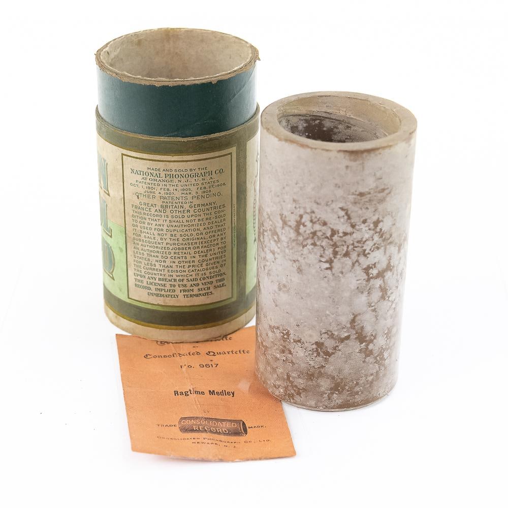 Consolidated Quartette Ragtime Brown Wax Cylinder: This remarkable find features an early 20th-century phonograph cylinder record manufactured by the Consolidated Phonograph Co., Ltd. of Newark, New Jersey. The lot includes the brown wax cylinder