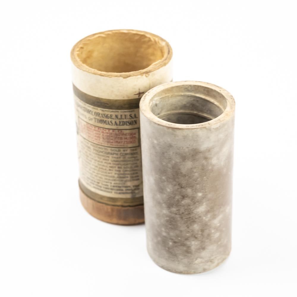 Brown Wax Cylinder Record Ching Ring: Brown wax cylinder record with hand written record slip, Coon Song Ching Ring by Frank Roberts. Actual song title is Ching Ring Coon. Cylinder in fair to poor condition with mold and haze. Comes in a 