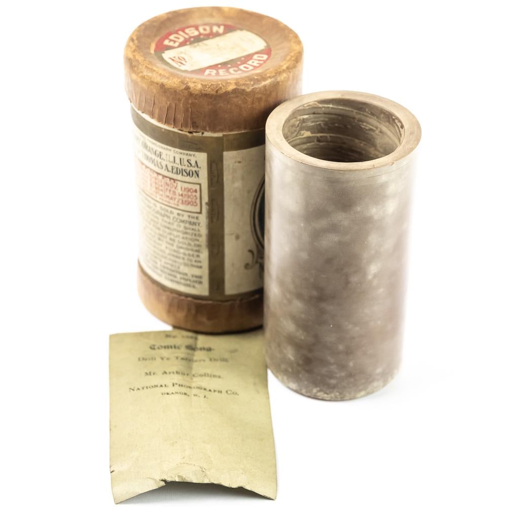 Edison Brown Wax Cylinder 1020: Brown wax Edison 1020 cylinder. Typical surface mold, minor scuffs, no structural issues. With original slip insert that reads No. 1020. Comic Song, ‘Drill Ye Tarriers Drill’ Mr. Arthur