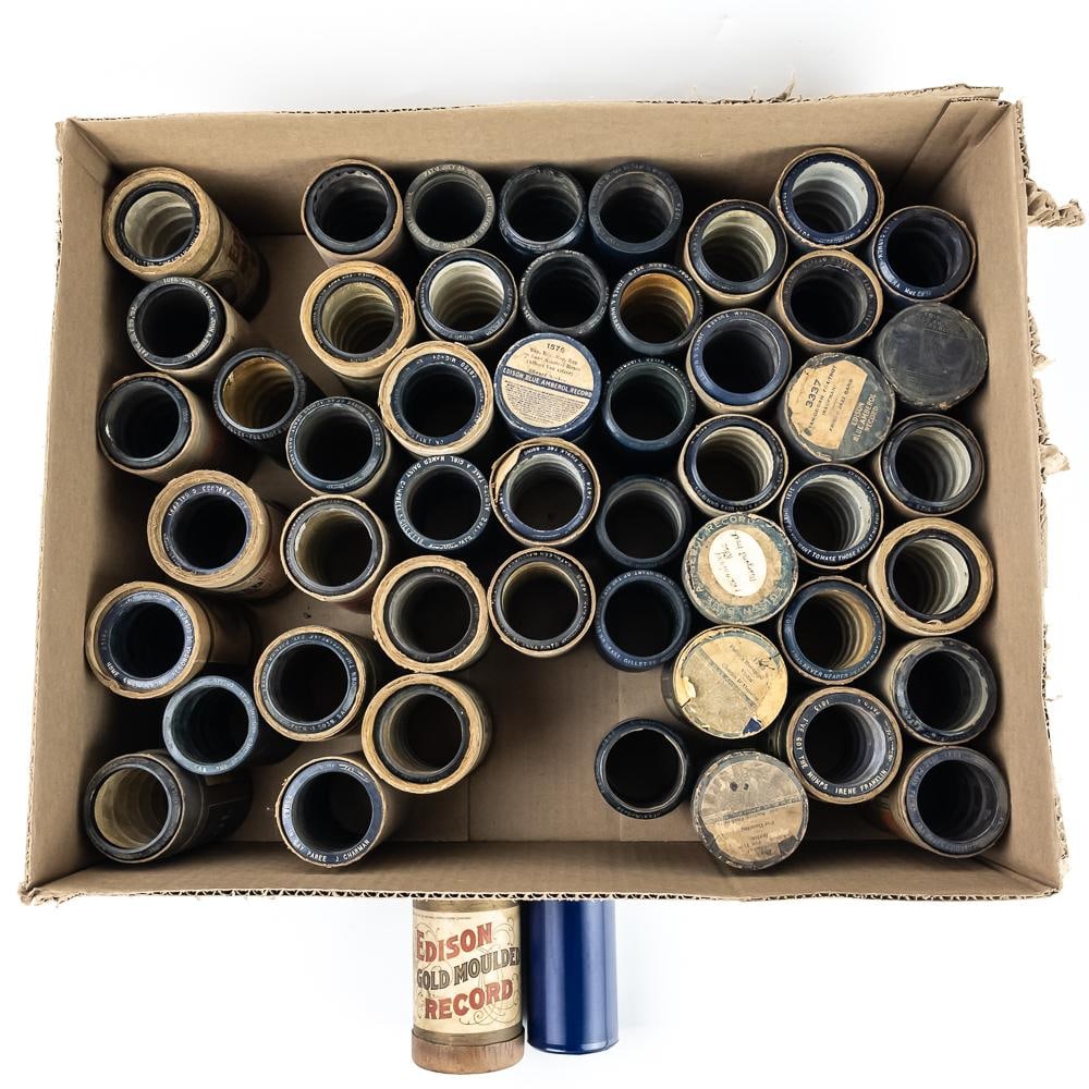 50 Edison Blue Amberol Cylinder Records: Lot of 50 early 20th-century Edison Blue Amberol cylinder records featuring a diverse array of period music, instrumentals, and spoken-word acts produced in Orange, New Jersey. This lot predominantly