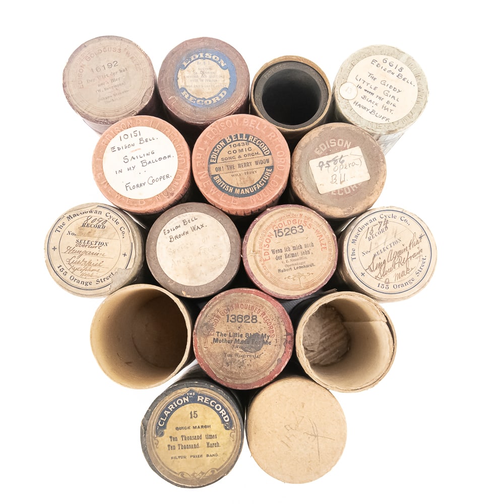 Lot of 16 Cylinder Record Boxes: A fantastic collection of 16 cylinder record boxes from the early 1900s, showcasing a wonderful cross-section of early record history. This lot features prominent manufacturers of the era, including