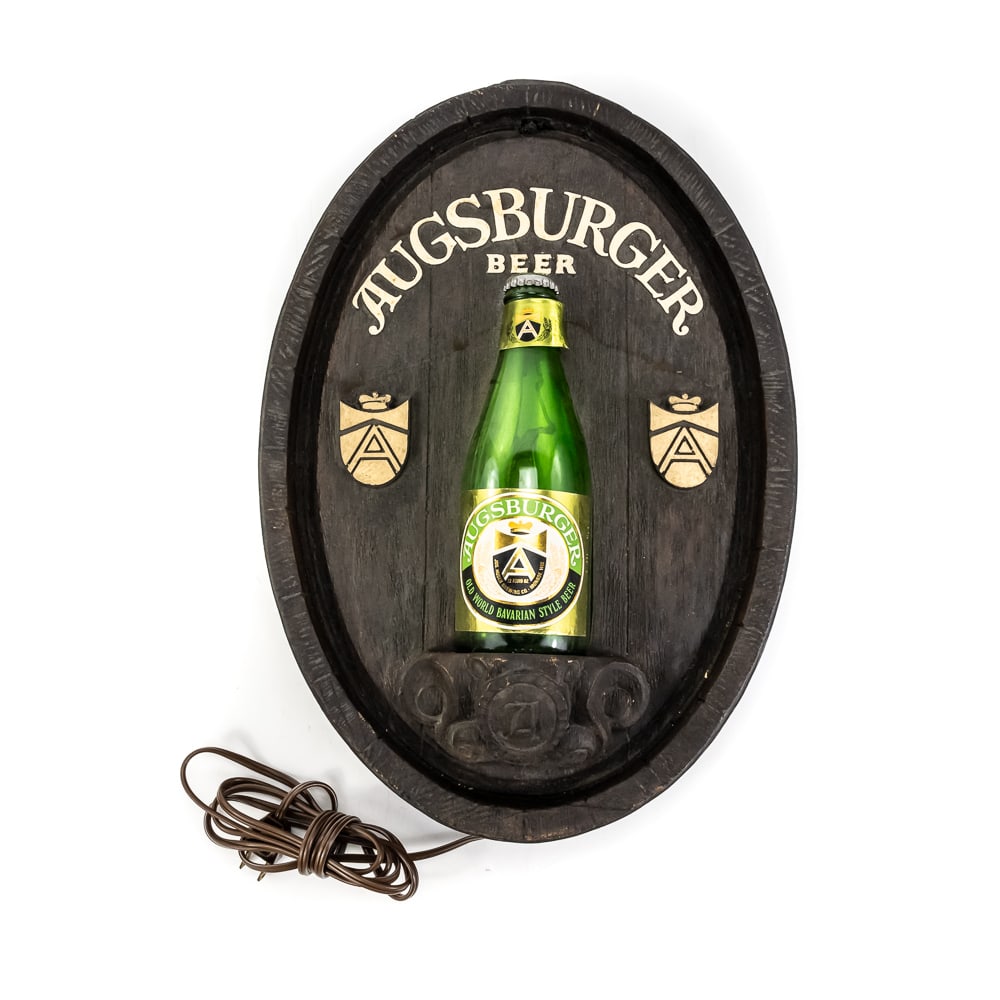 Vintage Augsburger Beer Advertising Sign: Vintage Augsburger Beer Advertising Sign, features a blow molded barrel-shaped plaque, a green bottle is displayed in the center, lights up, good condition, see photos. 15" x 10 1/2"