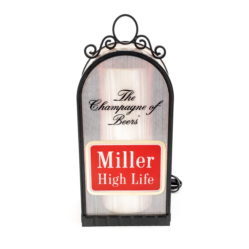 Vintage Miller High Life Lighted Bar Sign: Vintage Miller High Life Lighted Bar Sign, featuring the iconic "Champagne of Beers" slogan, jukebox-style plastic front casing, black scroll piece on top had to be re-attached., no cracks, lights up,