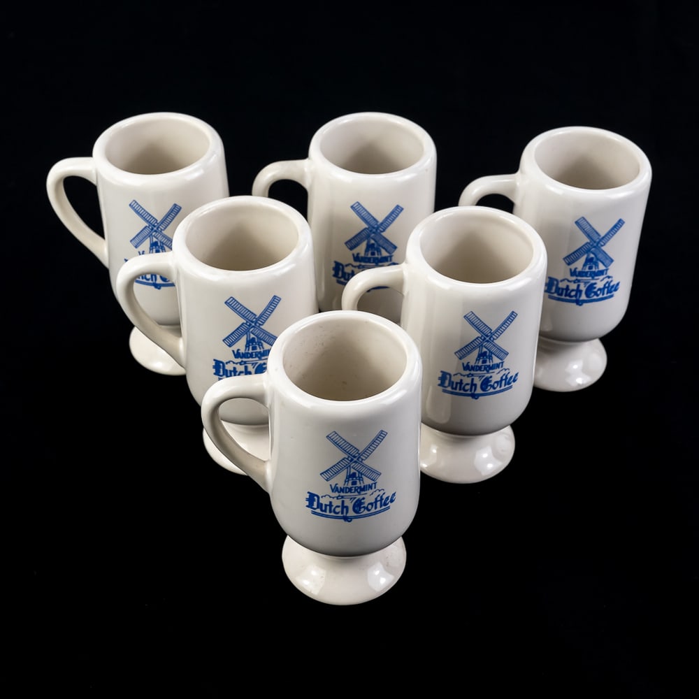 Set of Six Vandermint Dutch Coffee Pedestal Mugs: Set of Six Vandermint Dutch Coffee Pedestal Mugs, a popular Dutch liqueur flavored with mint and chocolate, white stoneware body, pedestal base and a blue Delft-style windmill graphic, new, unused