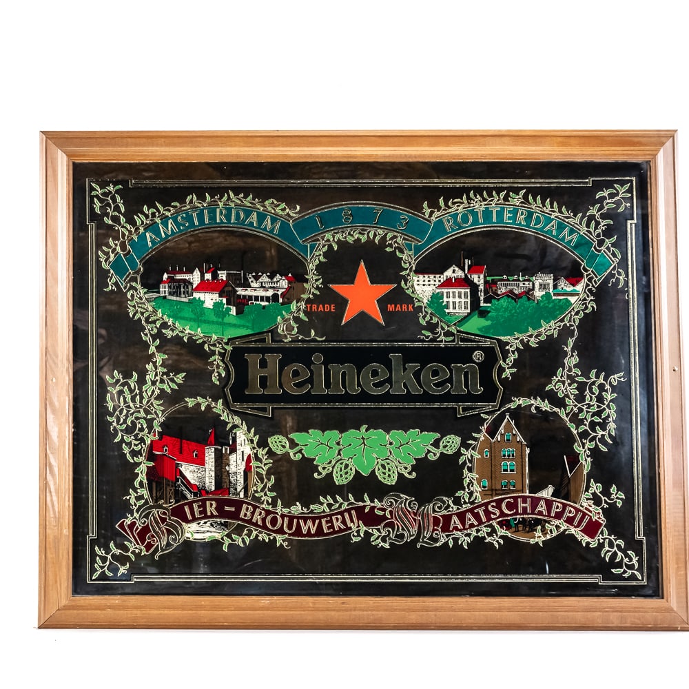 Vintage Heineken Framed Bar Mirror: Vintage Heineken Framed Bar Mirror, features vintage graphics depicting the brand's early brewery operations and locations, classic "Heineken" logo, shows text "Amsterdam - 1873 - Rotterdam" curving a