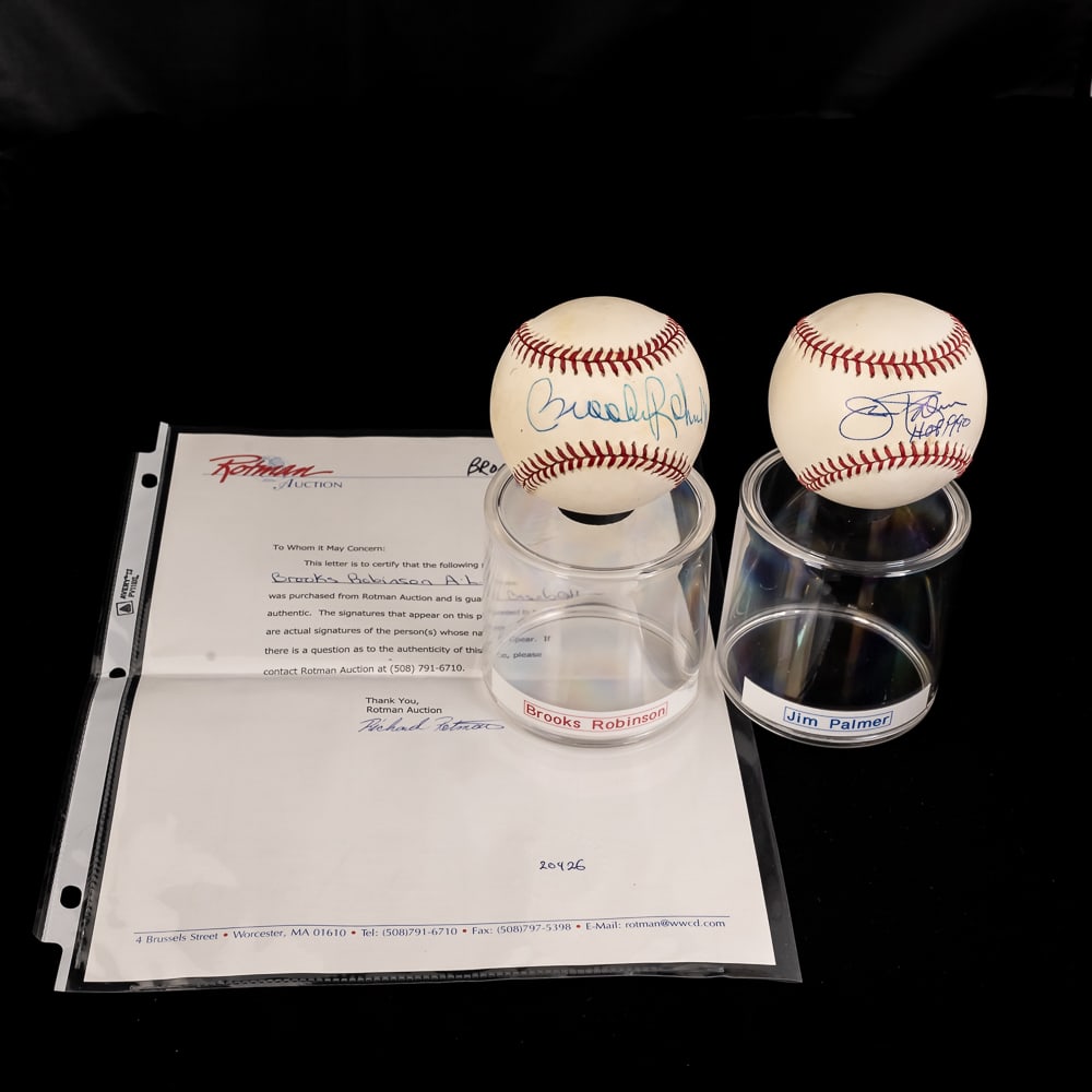 Brooks Robinson & Jim Palmer Autographed Baseballs: Baltimore Oriole fan favorites & 16 time Gold Glove recipient Brooks Robinson autographed Official American League Baseball with Rotman LOA along with additional Orioles HOFer Jim Palmer autographed (
