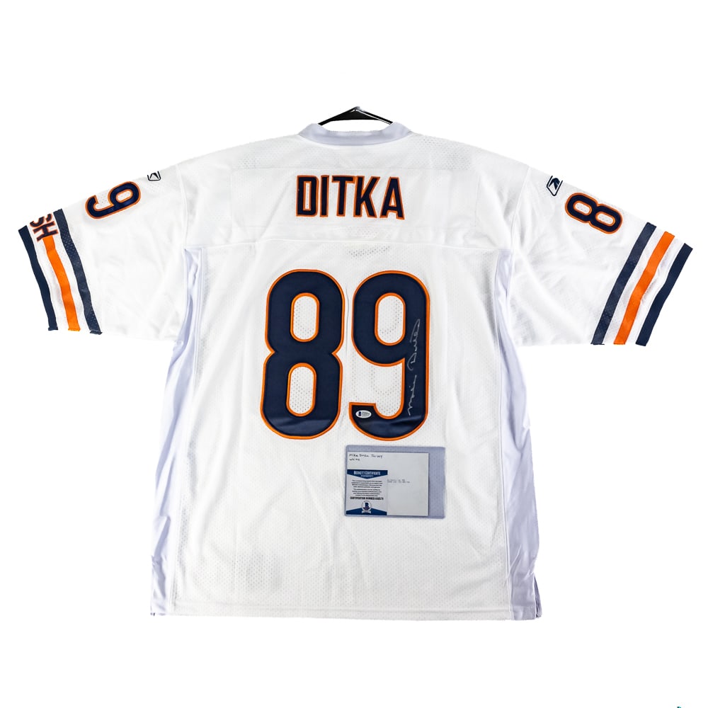 Mike Ditka Autographed Chicago Bears Jersey w COA: Chicago Bears Great Iron Mike Ditka autographed NWT Reebok White (AWAY) Jersey featuring Beckett Authentication with photo of signing. Ready to be framed up!! Perfect addition to your collection, plea