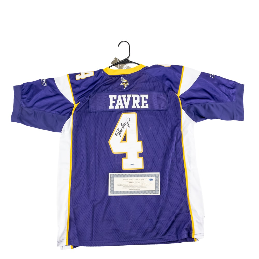 Brett Favre Autographed Minn. Vikings Jersey W COA: Brett Favre autographed green Minnesota Vikings Reebok jersey featuring Authentic Sports Memorabilia Authentication COA. Bold centralized black felt tipped signature. Ready to be framed up!! Perfect a