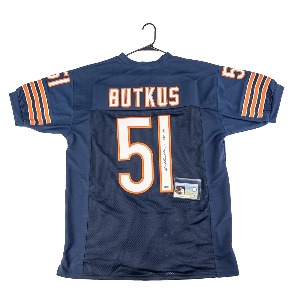 Dick Butkus Autographed Chicago Bears Jersey w COA: Chicago Bears Great Dick Butkus autographed Blue (Home) Jersey featuring Schwartz Authentication with photo of signing. Bold black felt tipped signature featuring HOF 79 inscription on #1. Ready to be