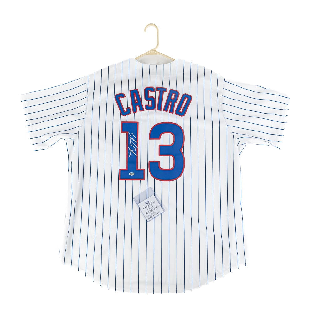 Starlin Castro Autographed Chicago Cub Jersey wCOA: Starlin Castro autographed Chicago Cubs Majestic white pinstripe jersey featuring Sids Graphics COA. Bold centralized silver felt tipped signature. Ready to be framed up!! Perfect addition to your col