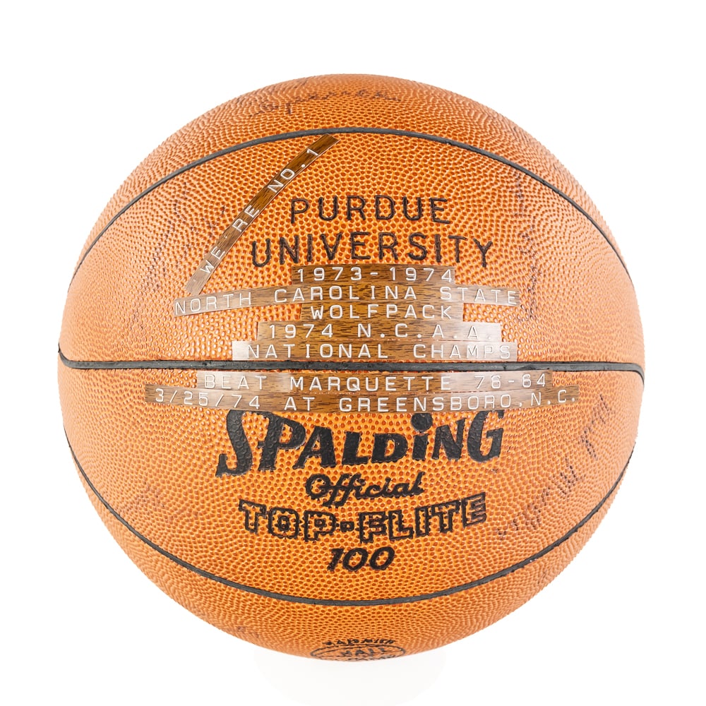 73-74 NCAA NC State Natl Champ Autographed Ball: 1973-1974 North Carolina State WOLF PACK 1974 N.C.A.A. National Champions Team autographed Purdue University Spalding Official Top Flight 100 Hall of Fame Memorial basketball. Showcasing Dave Thompson