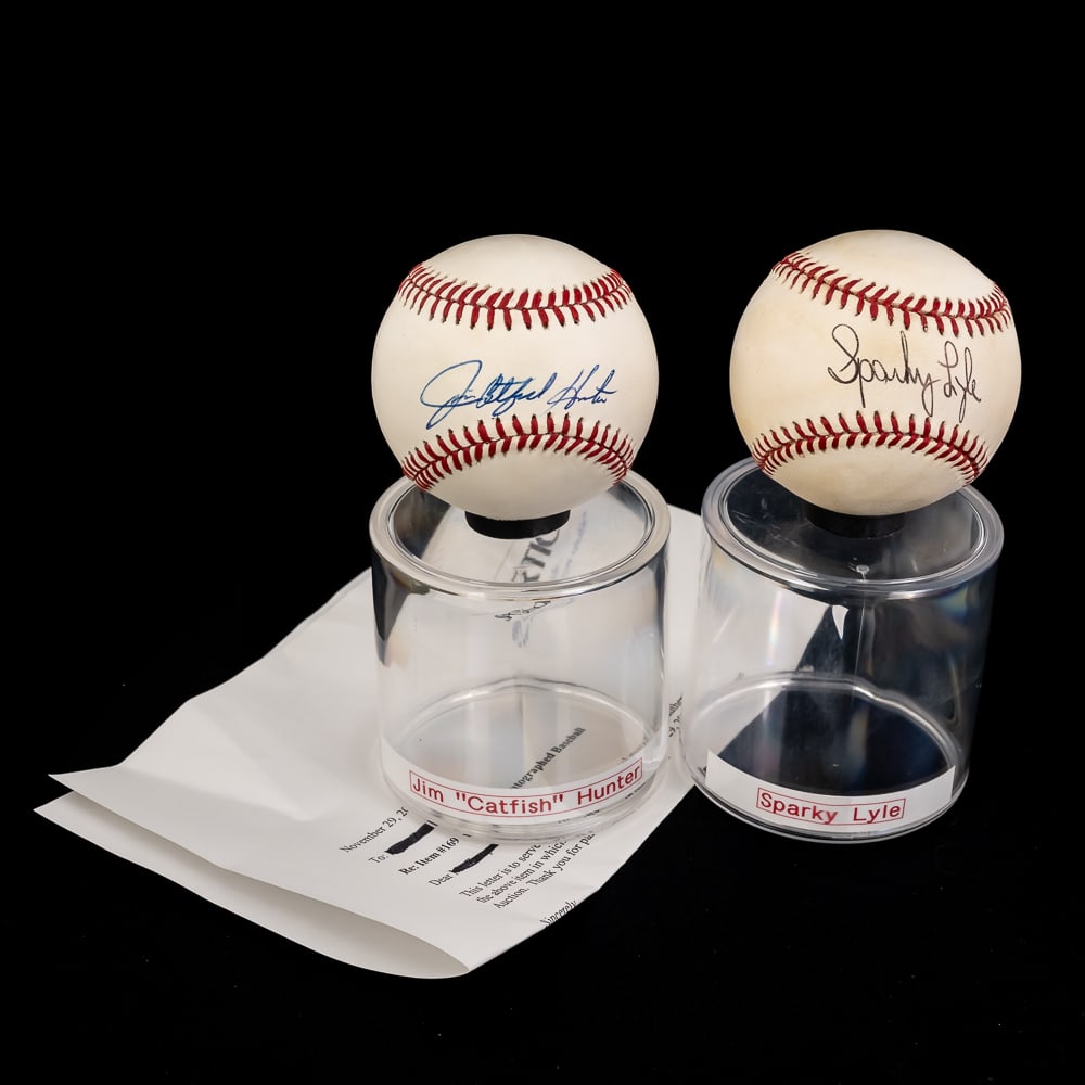 Jim Catfish Hunter & Sparky Lyle Signed Baseball: Featuring Jim "Catfish" Hunter autographed Rawlings Official American League Baseball with Sportico LOA along with additional Sparky Lyle autographed Official American League Baseball with Steiner Hol