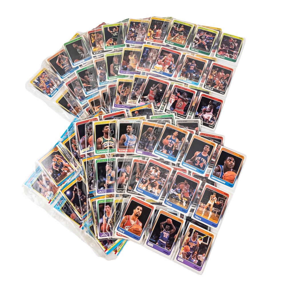 88-89 Fleer NBA Basketball Complete Set w Stickers: 1988-1989 Fleer NBA Basketball complete 132 card set along with (11) supplemental sticker set. Set features (3) early Jordan cards. Investor set with binder presentation with examples showcasing sharp