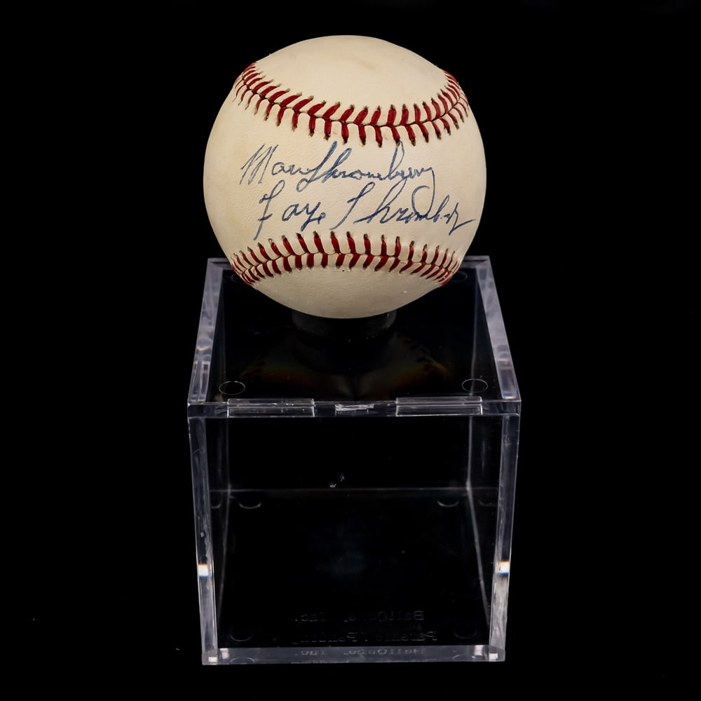 Marv & Faye Thronebery Autographed OAL Baseball: Marv & Faye Thronebery double autographed Rawlings Official American League MLB Baseball. Bold Blue ink double signature smack dab in the sweet spot !!! Showcased inside handsome acrylic display