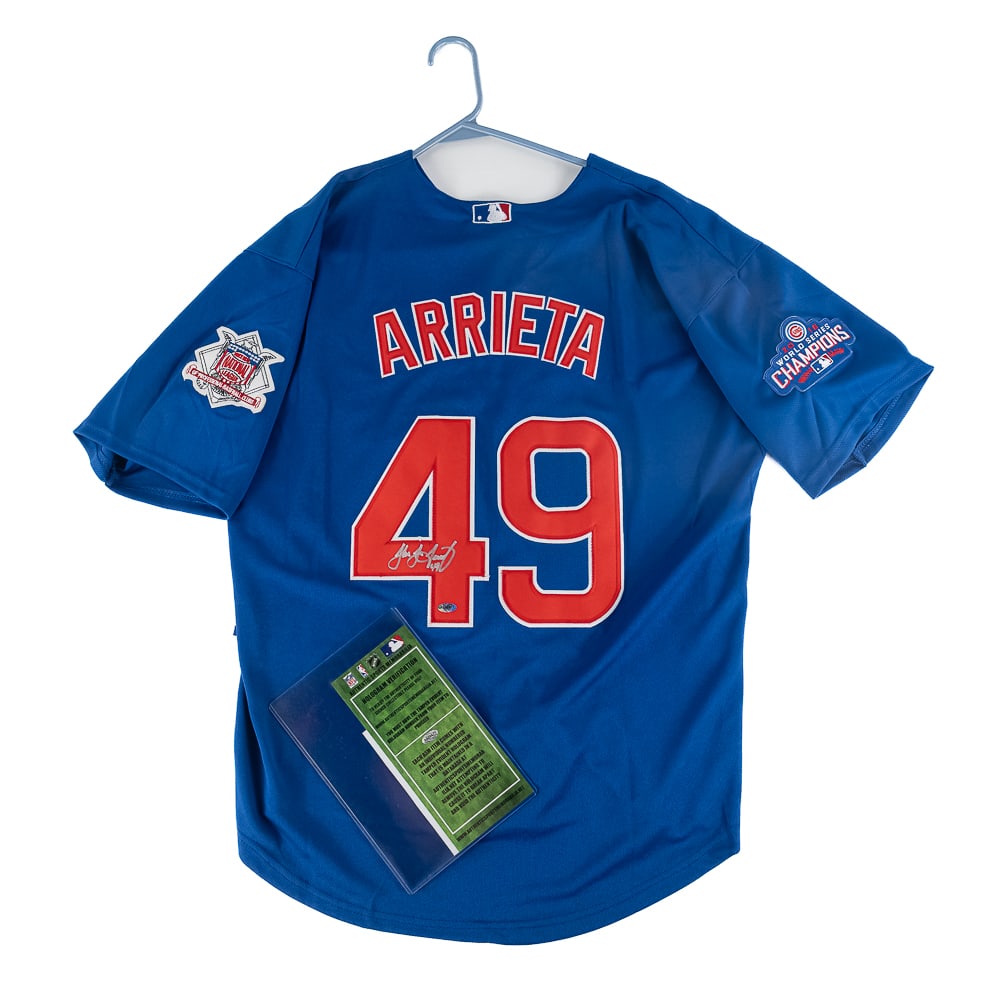 Jake Arrieta Autographed 2016 Cubs WS Jersey w COA: Jake Arrieta autographed blue Majestic Chicago Cubs 2016 World Series Jersey featuring Authentic Sports Memorabilia Authentication COA. Bold centralized silver felt tipped signature. Ready to be frame