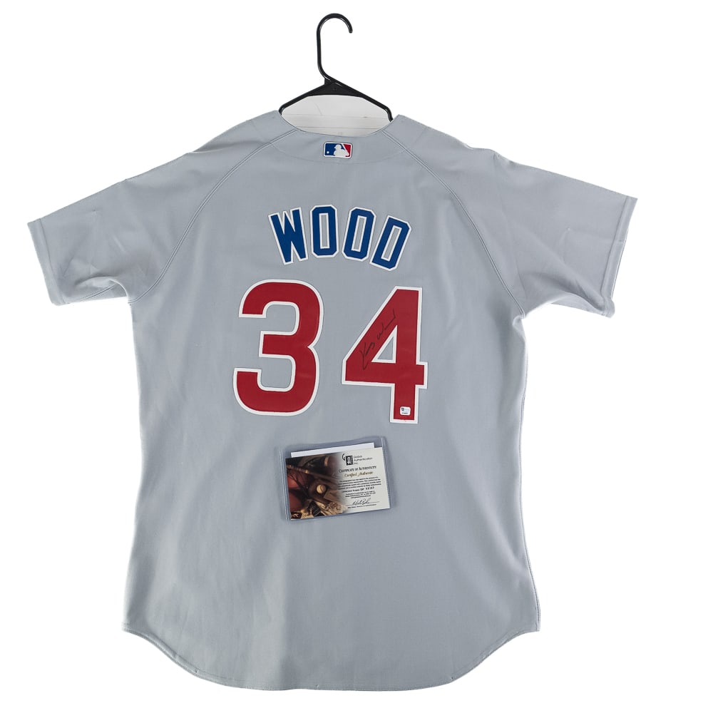 Kerry Wood Signed Team Issued Cubs Jersey w COA: Kerry Wood autographed Chicago Cubs TEAM ISSUED NWT Majestic jersey featuring Global Authentication COA w signing photo. Bold blue felt tipped signature on front. Ready to be framed up!! Perfect addit