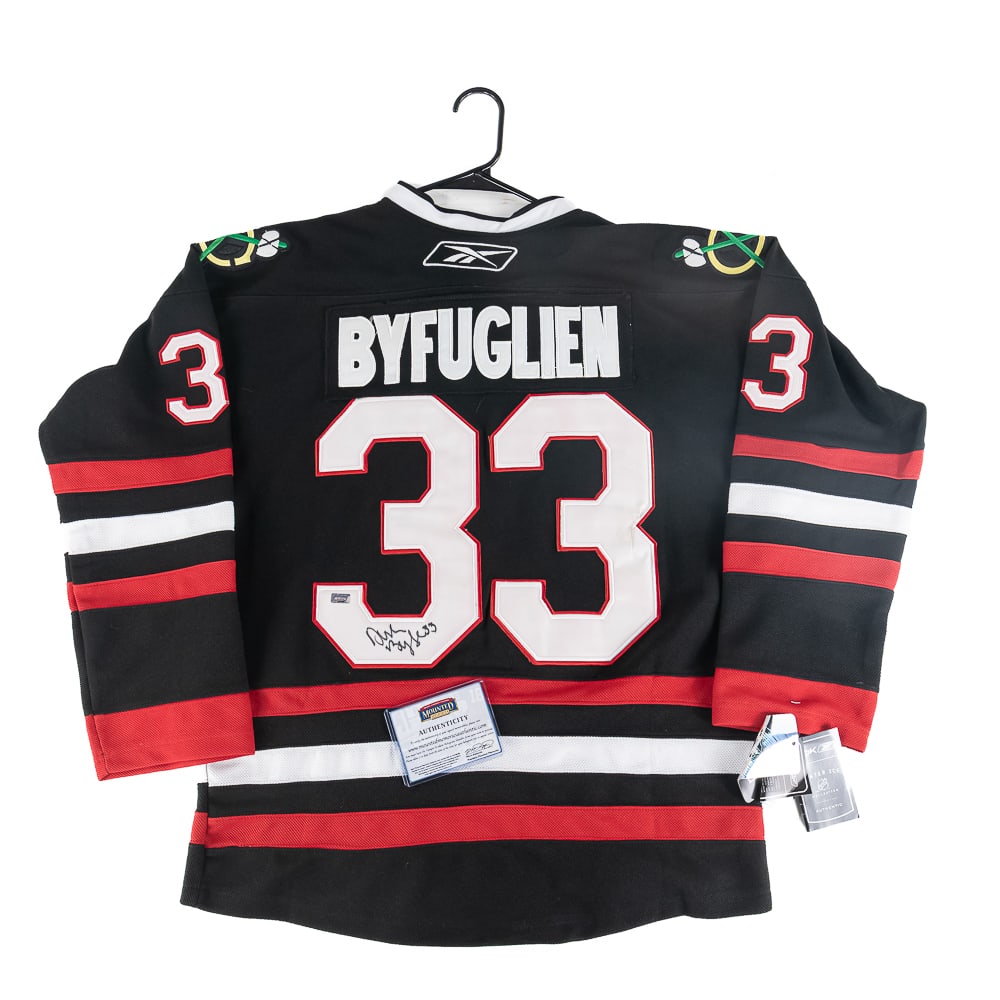 Dustin Byfuglien Autographed Blackhawk Game Jersey: Dustin Byfuglien autographed Chicago Blackhawks NWT Reebok 2010 Stanley Cup Game Jersey featuring Mounted Memories COA. Centralized black felt tipped signature. Ready to be framed up!! Perfect