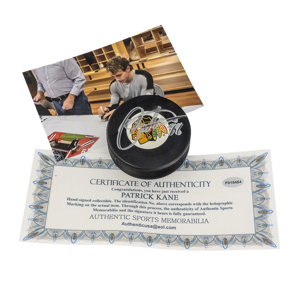 Patrick Kane Signed Blackhawks NHL Puck w COA: Patrick Kane #88 2013 Autographed Chicago Blackhawks NHL Officially Licensed puck. Perfectly accented with an attractive bold silver signature featuring Authentic Sports Memorabilia COA with signing p