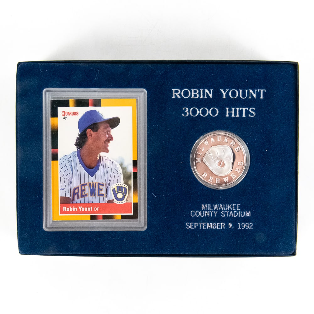 Robin Yount 3k Hit Commemorative .999 Silver Round: Robin Yount 3000 Hit September 9, 1992 Milwaukee County Stadium commemorative display. Featuring Milwaukee Brewers .999 Fine Silver Troy Ounce silver proof round perfectly accented with an 1988 Donrus