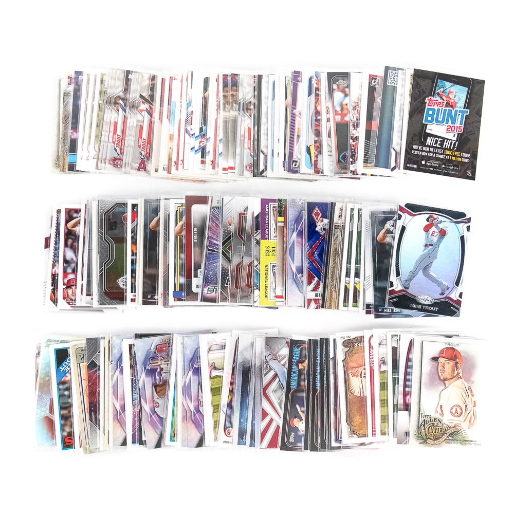 (150) Mike Trout MLB Baseball Card Assortment: Collection of (150) assorted Mike Trout MLB Baseball Cards. Lots of Fun !!! Some REALLY nice cards many with sharp edges and corners ( Mint overall); some doubles. Exactly As Pictured Perfect