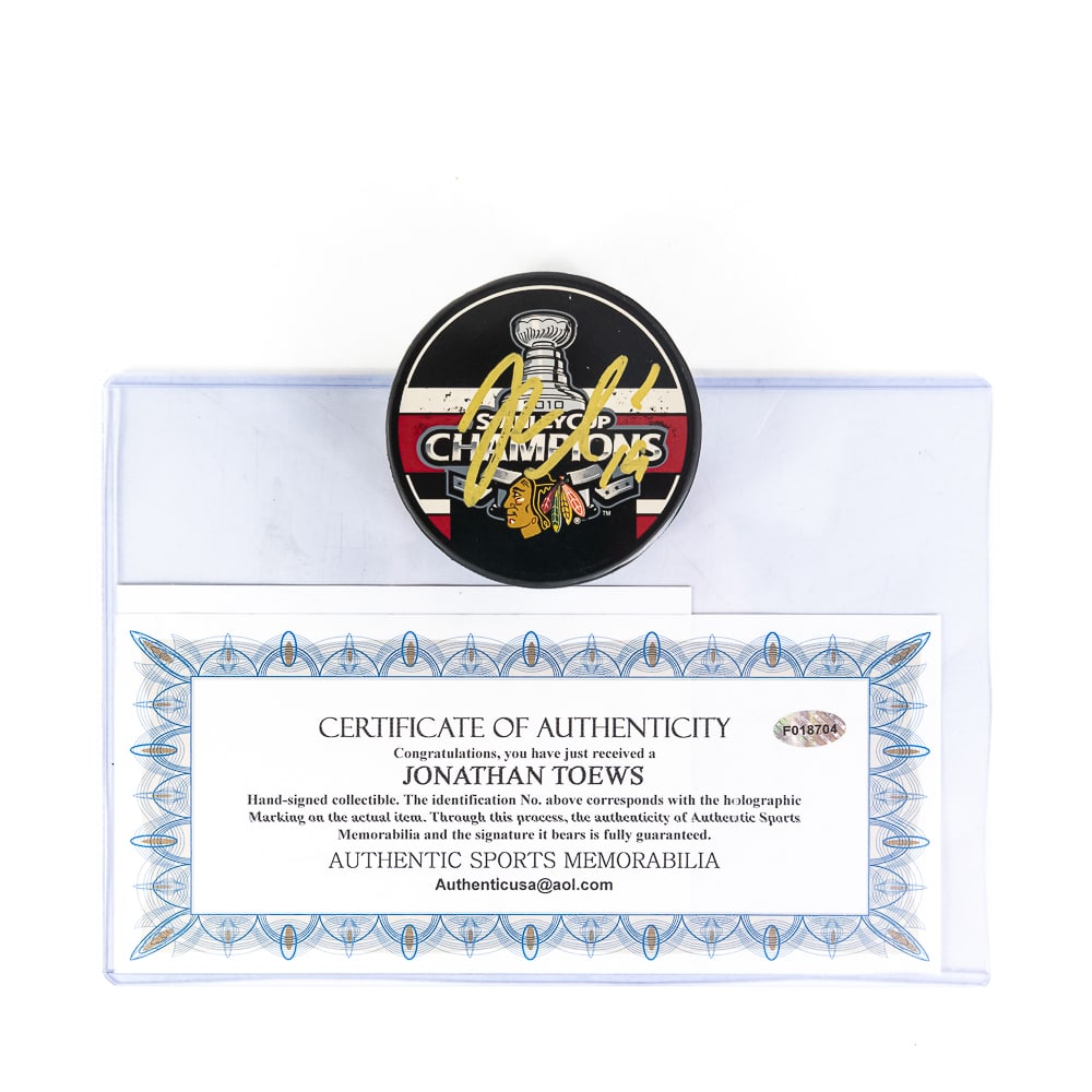 Jonathan Toews Signed 10 Stanley Cup Champion Puck: Jonathan Toews #19 Autographed 2010 Stanley Cup Champions NHL Officially Licensed puck. Perfectly accented with an attractive bold GOLD signature featuring Authentic Sports Memorabilia COA with