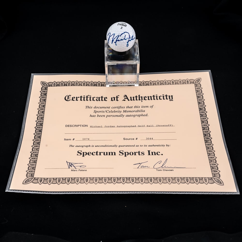 Michael Jordan Autographed Wilson Golf Ball: Michael Jordan autographed Wilson Pro Staff 3 Golf ball. Attractive bold beautiful blue felt tipped signature; with Spectrum Sports COA. Showcased inside acrylic display. Please use photos to judge co