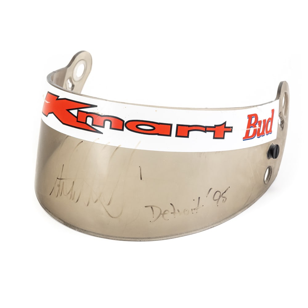 Paul Tracy Autographed Bud & Kmart Racing Visor: Paul Tracy autographed & inscribed "Detroit '95" "Bud" & "K-Mart" branded full size vintage helmet visor. Presents well with some fading and age with a small crack at "K". No COA, please use photos to