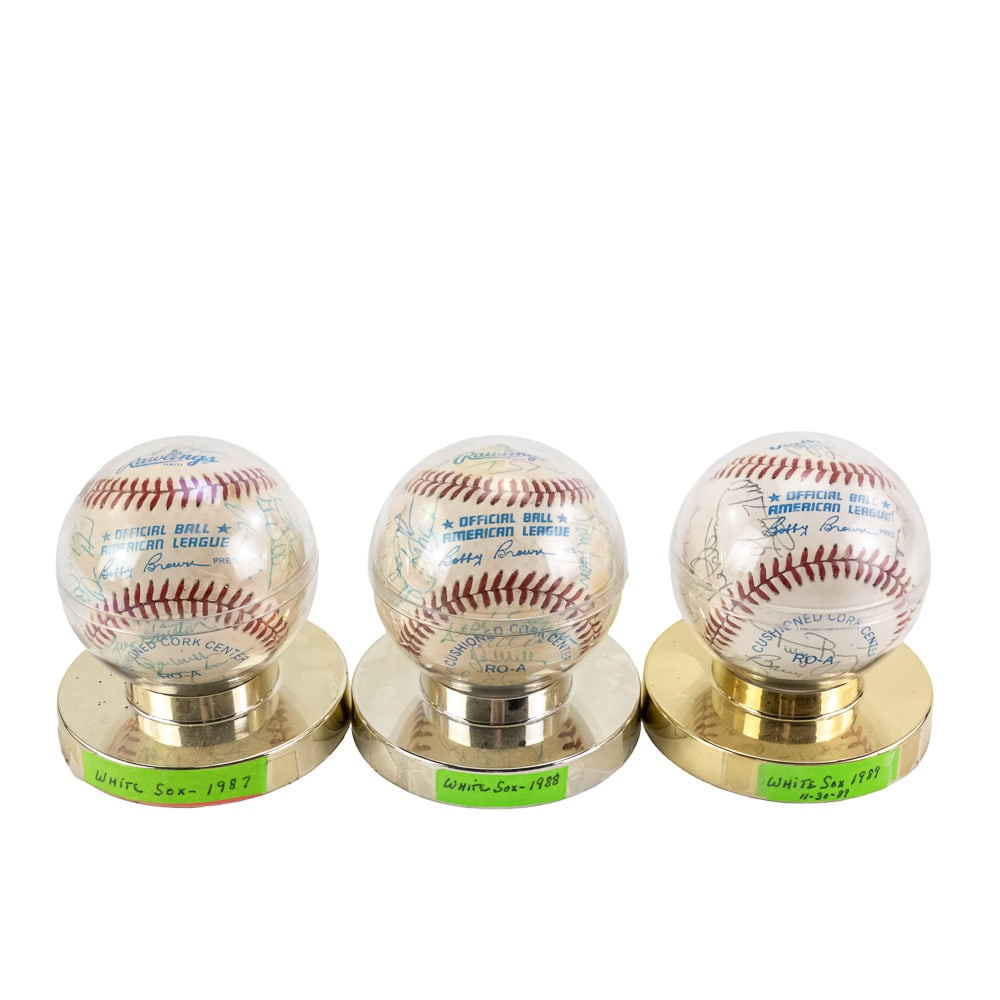 1987 1988 1989 Chicago White Sox Auto Baseballs: Collection showcases a 1987, 1988 & 1989 Chicago White Sox Team Autographed Rawlings official American League baseballs with ball ink signatures and are presented inside acrylic baseball displays.