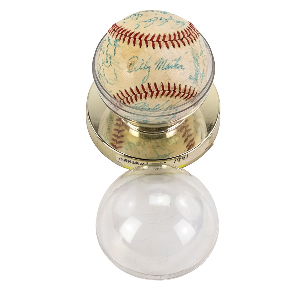 1980 Oakland As Team Autographed Baseball: 1980 Oakland Athletics team autographed baseball showcasing (26) signatures including manager Billy Martin perfectly placed on the sweet spot along with a young Rickey Henderson. Martin became an