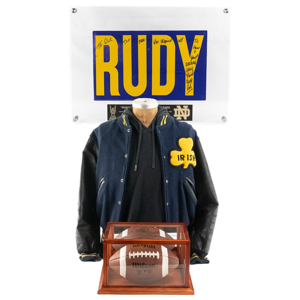 3 RUDY Motion Picture Used Props/Notre Dame: Includes: Rudy Motion Picture Used FootballFootball Description: Custom made Wilson Official TD Intercollegiate “Notre Dame” game football. Features genuine pebbled cowhide leather
