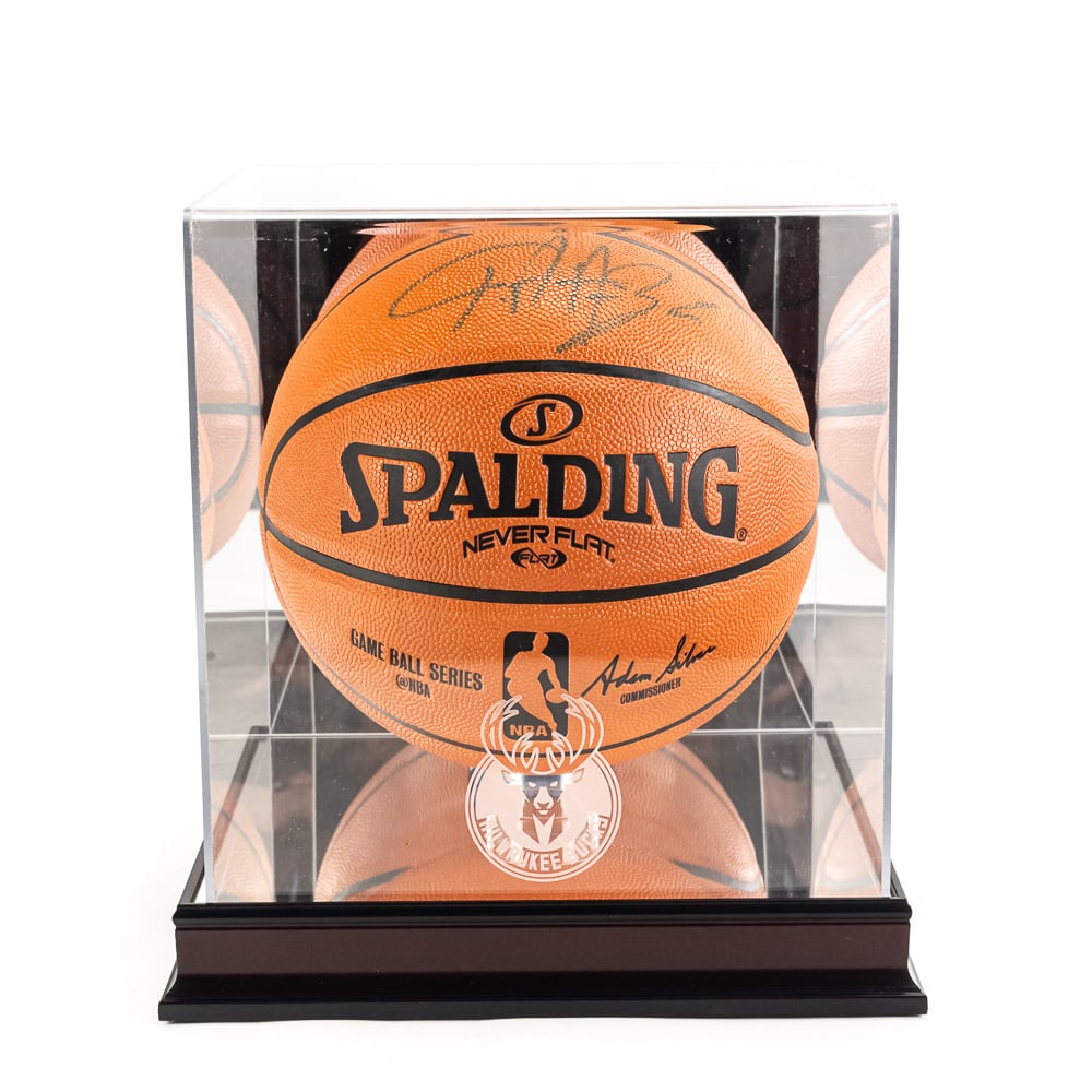 Giannis Antetokounmpo Autographed Basketball: Title: Giannis Antetokounmpo Autographed BasketballBasketball Make: Spalding Model SP-74872Pro Display Case: UV glass with etched Milwaukee Bucks logo, mirror case bottom and natural wood baseDate of