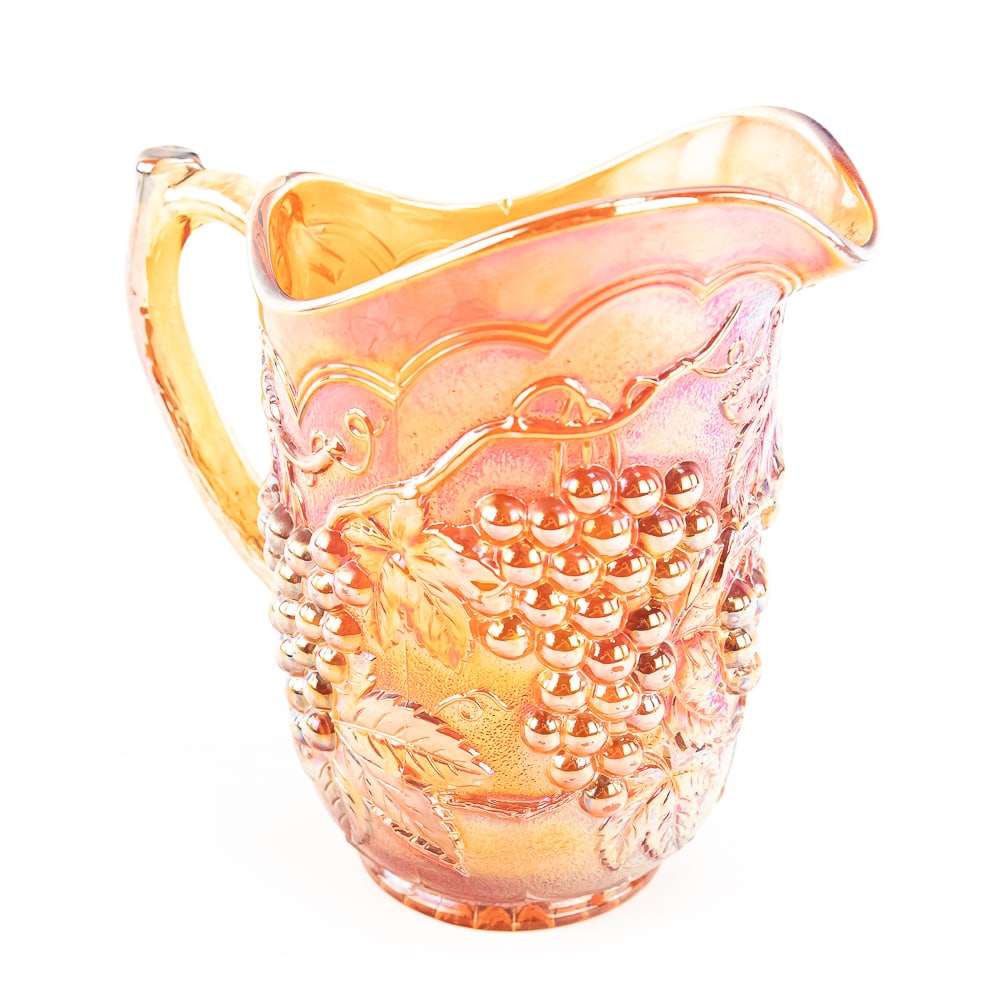 Carnival Glass: Imperial Grape Pitcher: Amber. Very good condition with very nice iridescence.See photos to judge condition and bid accordingly.8.25 in.