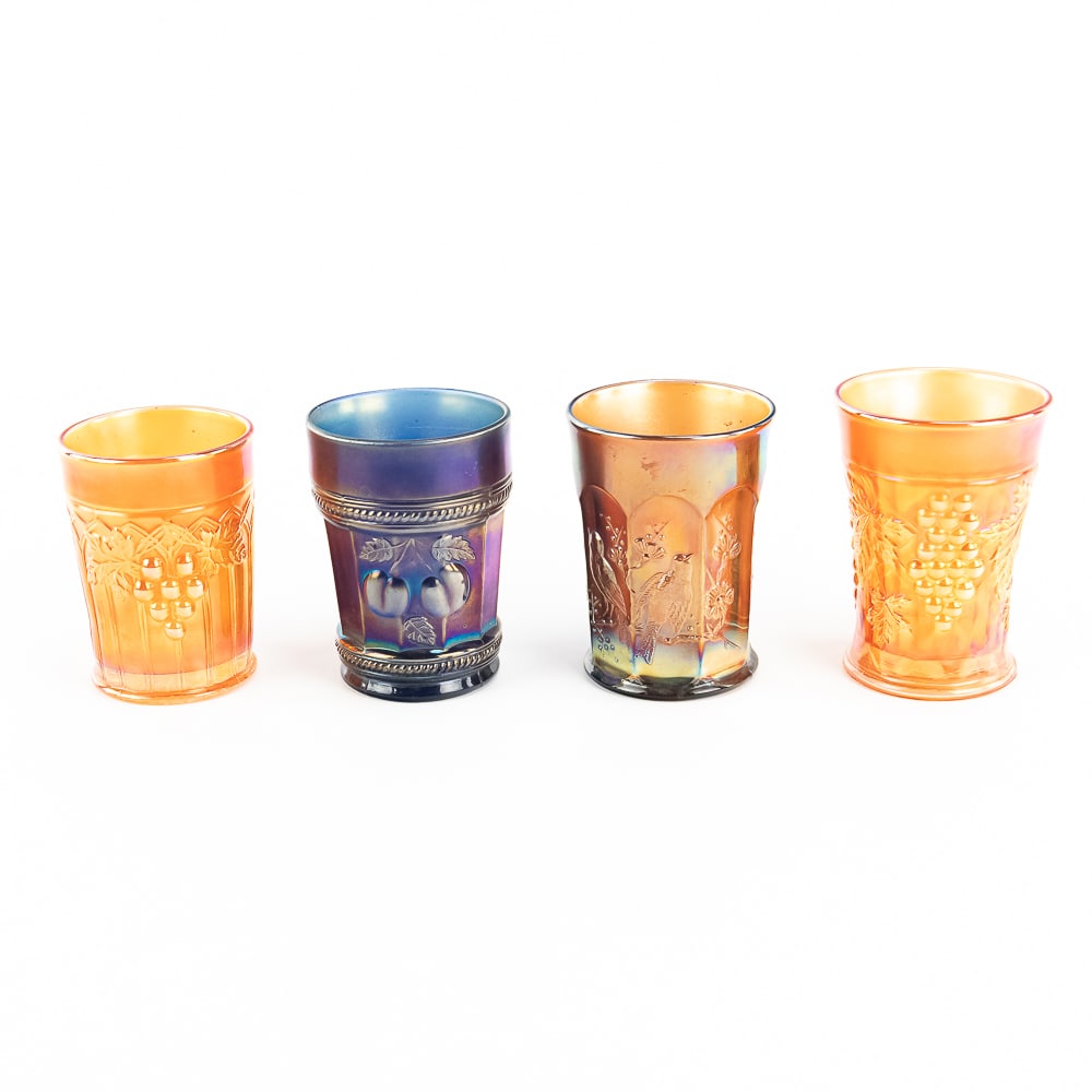 Carnival Glass: N'wood Tumblers 4-Pc: 4-piece lot of Northwood tumblers. Peach in blue (roughness on the base). Singing Birds in amethyst purple (soft iridescence, no damage). Gothic Arches in marigold (no damage). Grape Arbor in marigold