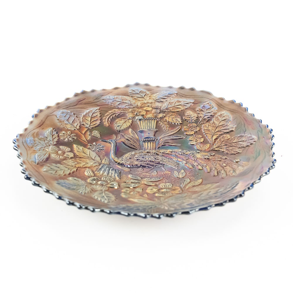 Carnival Glass: Fenton Peacock and Urn Plate: Blue. Features the bearded berry back. Good condition with pretty gold iridescence.See photos to judge condition and bid accordingly.9 in.