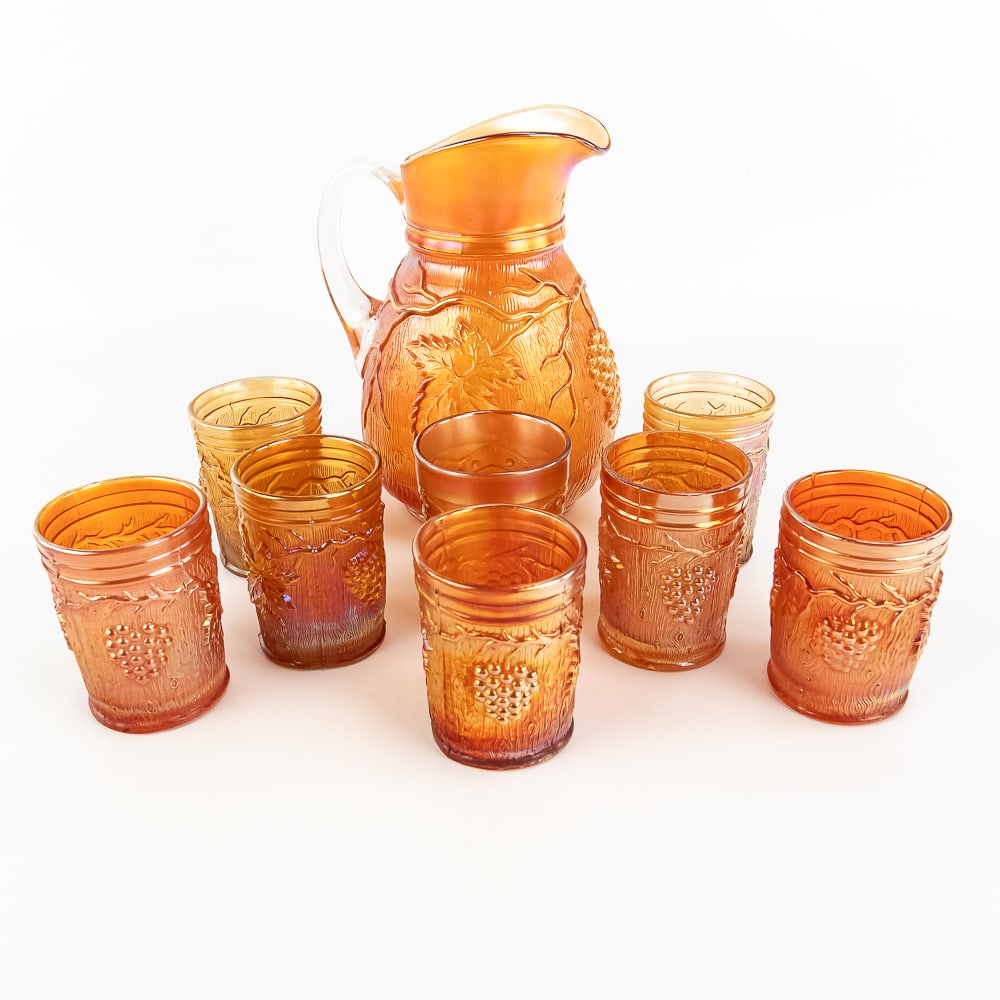 Carnival Glass: Dugan Vineland 8pc Water Set: Marigold. Pitcher and 7 tumblers. Very cool set in good condition. See photos to judge condition and bid accordingly.