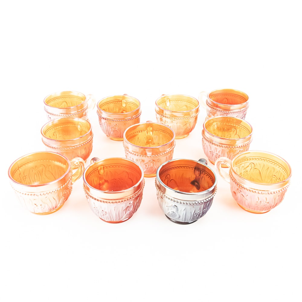 Carnival Glass: Diamond Cups 11-Pc Lot: 11-piece lot of Diamond Stork and Rushes cups. One amethyst and 10 marigold. All in good condition. See photos to judge condition and bid accordingly.