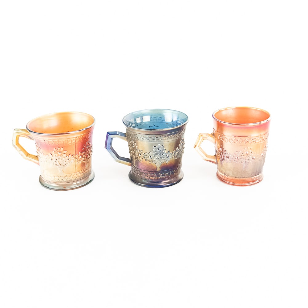Carnival Glass: Fenton Mugs 3-Pc Lot: 3-piece lot of Fenton Orange Tree mugs. Two are shaving mugs with 3-in bases (one blue, one lime green with a marigold overlay). The third is a standard-sized mug in marigold with a 2 1/2 in base. All