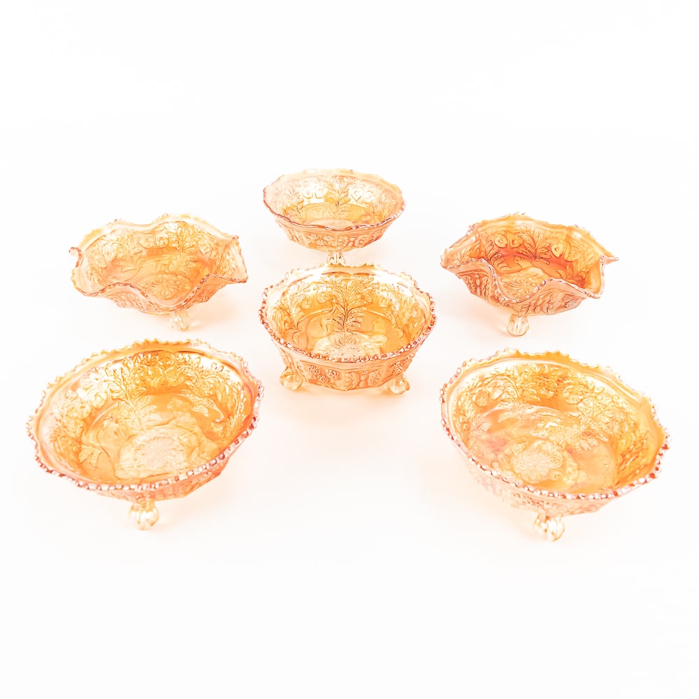 Carnival Glass: Fenton Panther 6-Pc: 6-piece lot of Fenton Panther footed berry bowls in marigold. Four are round and two are ruffled. All measure about 5 to 6 in across and are in fine shape. See photos to judge condition and bid accord