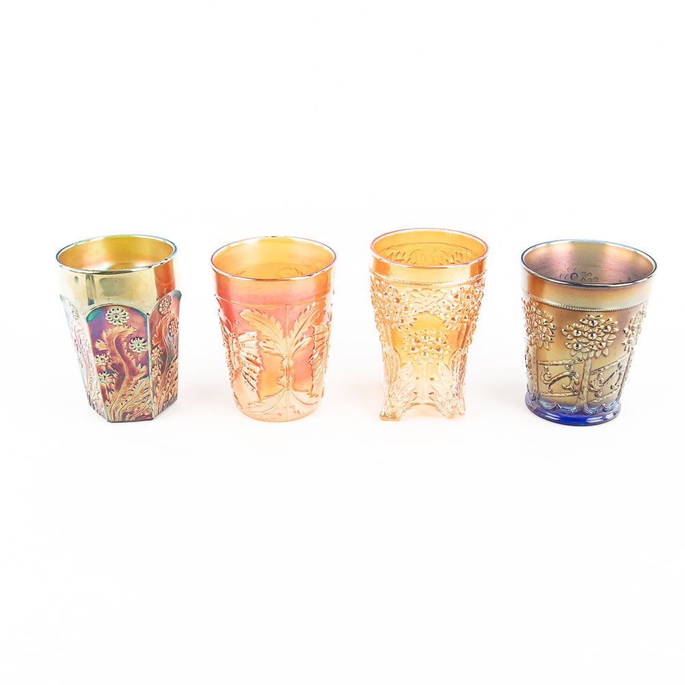 Carnival Glass: Fenton Tumblers 4-Pc: 4-piece lot of Fenton tumblers. Blue Orange Tree Orchard (no damage). Paneled Dandelion in green (factory ground base, no damage). Butterfly and Fern in marigold (pretty iridescence, no damage). Orang