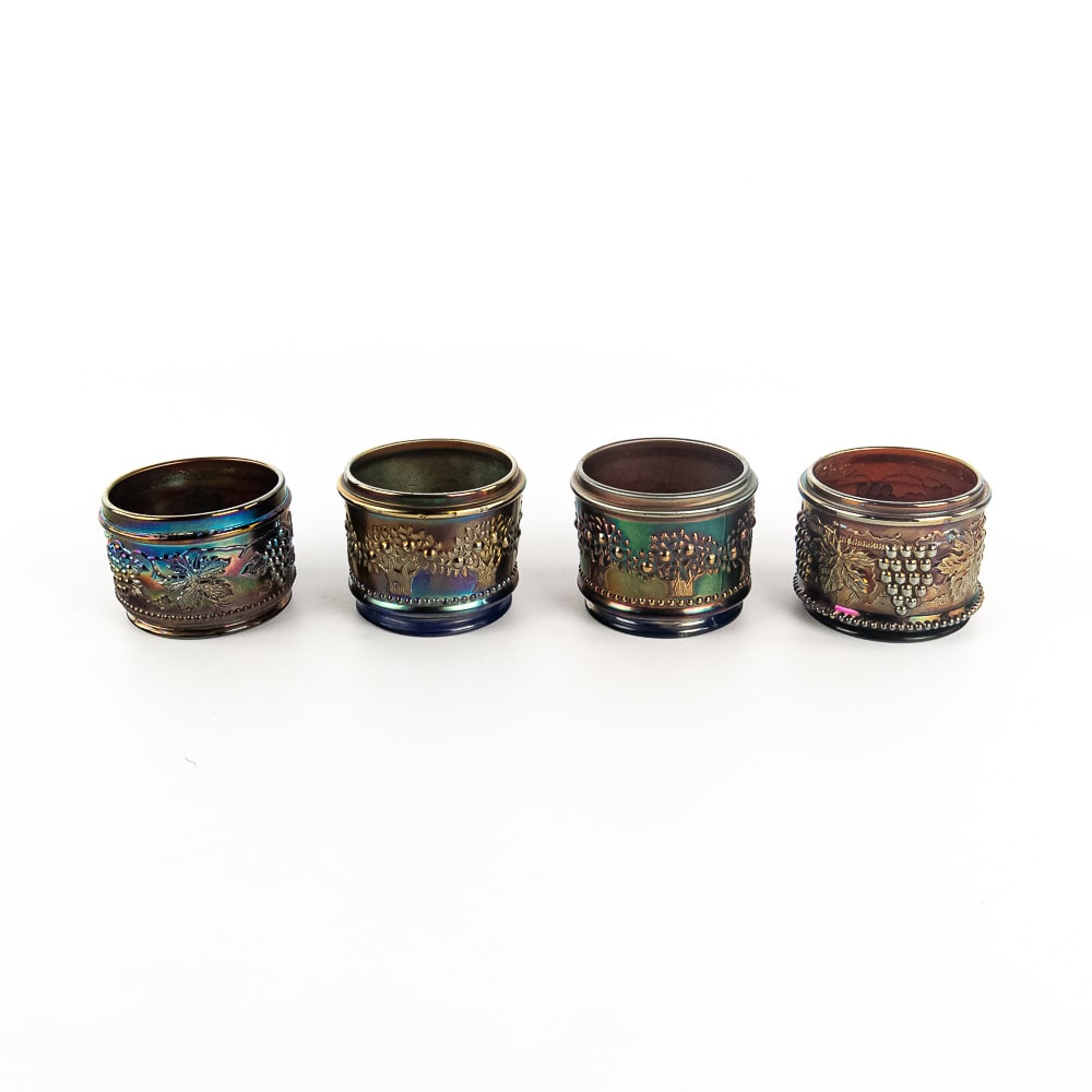Carnival Glass Powder Jar Bases: 4-Pc Lot: Bases only, no lids. Includes two Fenton Orange Tree in blue (one has a small flake where lid sits), a Northwood Grape and Cable in amethyst (fine condition), and a Dugan Vintage in purple (fine condi