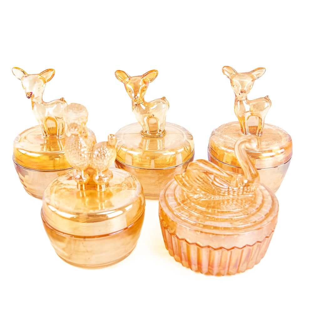 Carnival Glass: Jeannette Jars 5-Pc: 5-piece lot of Jeannette powder jars. Covered Swan in marigold. Covered Poodle in marigold. Three colored Bambies (one has a badly chipped nose). See photos to judge condition and bid accordingly.